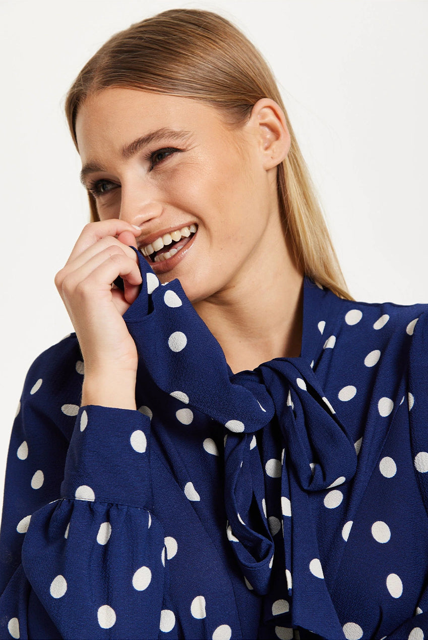 Navy Polka Dot Flared Hem Blouse 25SS8866009