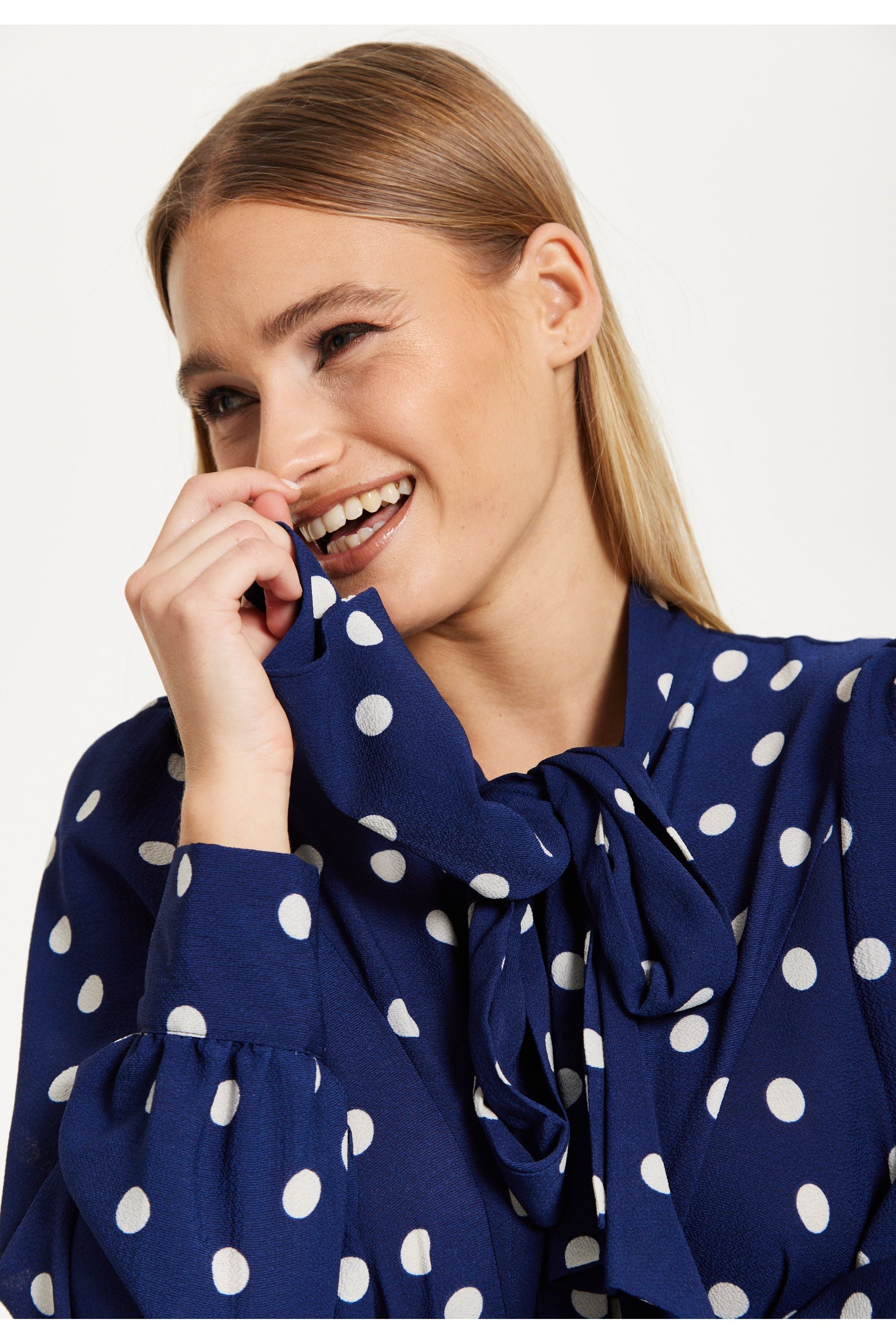 Navy Polka Dot Flared Hem Blouse 25SS8866009