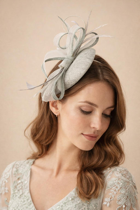 Round Pill Box Fascinator With Bow & Feathers In Grey by SVNX