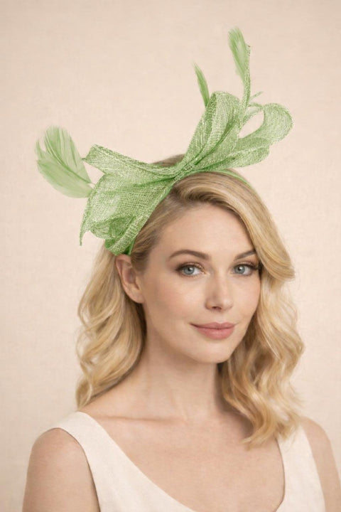 Bow Shaped Fascinator With Sinamay Curls & Feathers In Pastel Green by SVNX