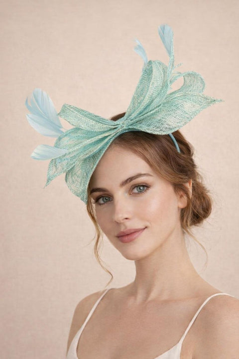 Bow Shaped Fascinator With Sinamay Curls & Feathers In Mint Blue by SVNX