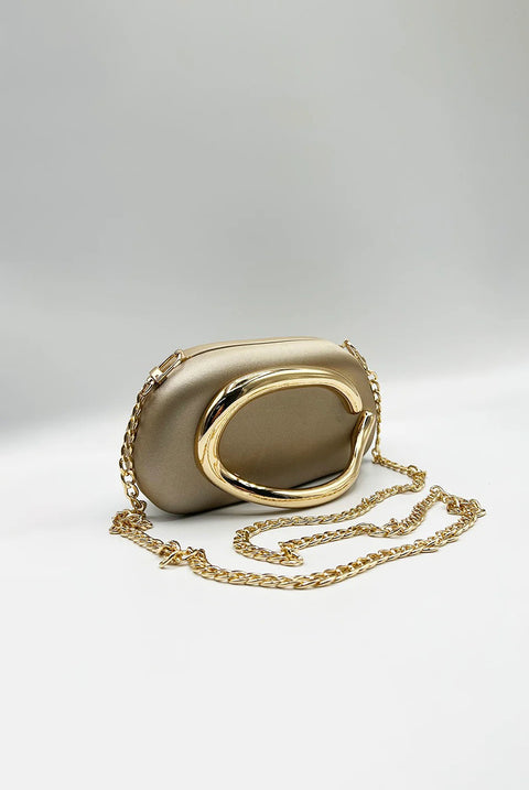 Oval Satin Hard Case Clutch Bag In Muted Gold by SVNX