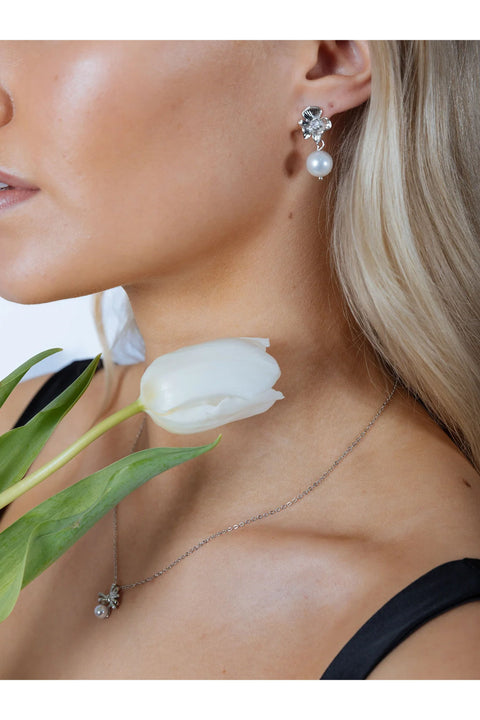 Flower Drop Pearl Earrings In Silver by SVNX