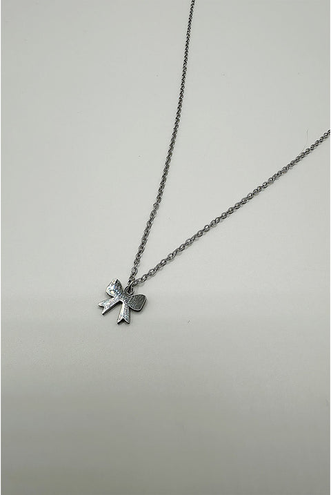 Mini Bow Pendant Necklace In Silver by SVNX