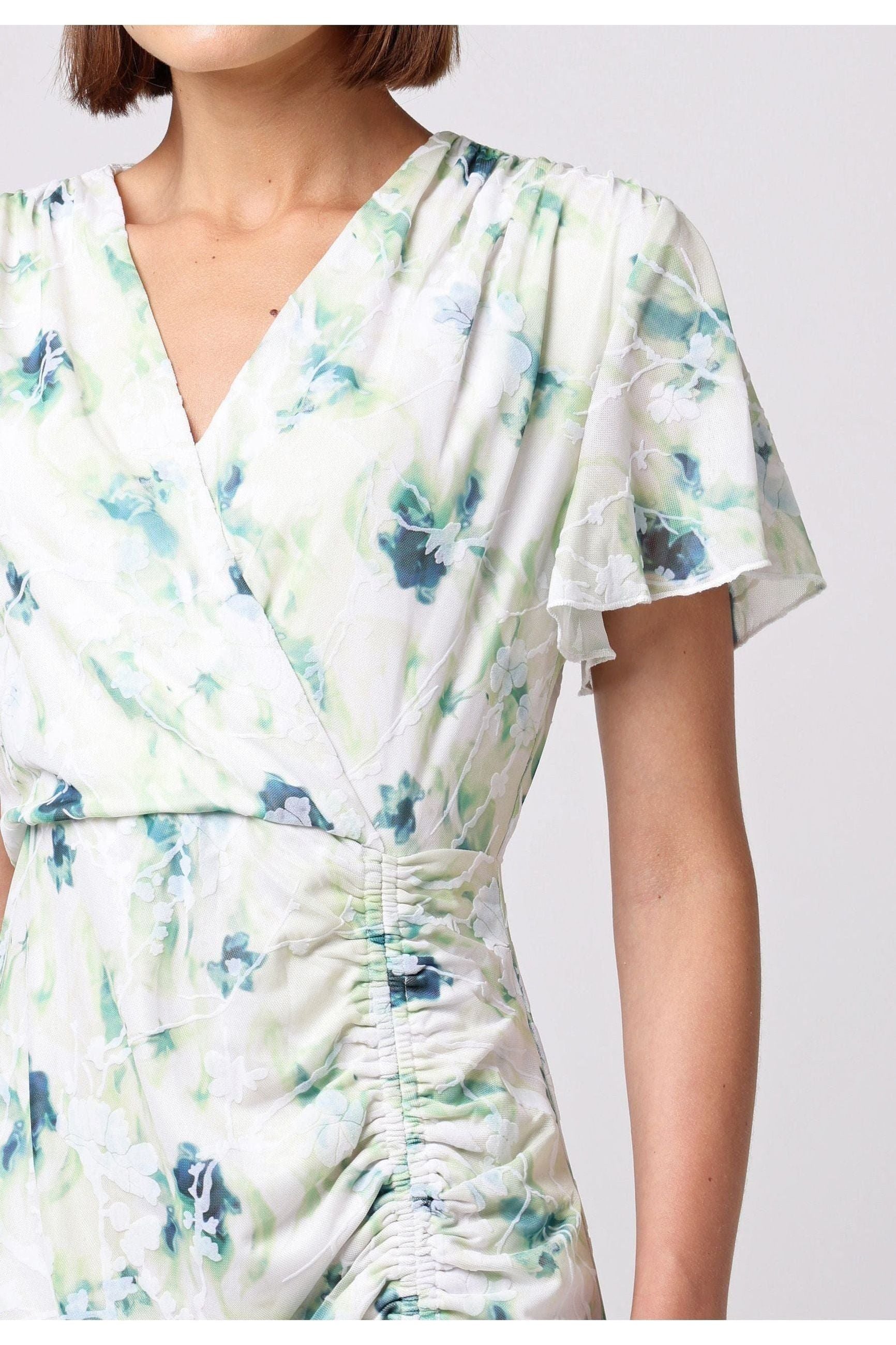 Wrap Ruched Mini Dress With Ruffle Hem In Green Floral Burnout Print M035500GRNF