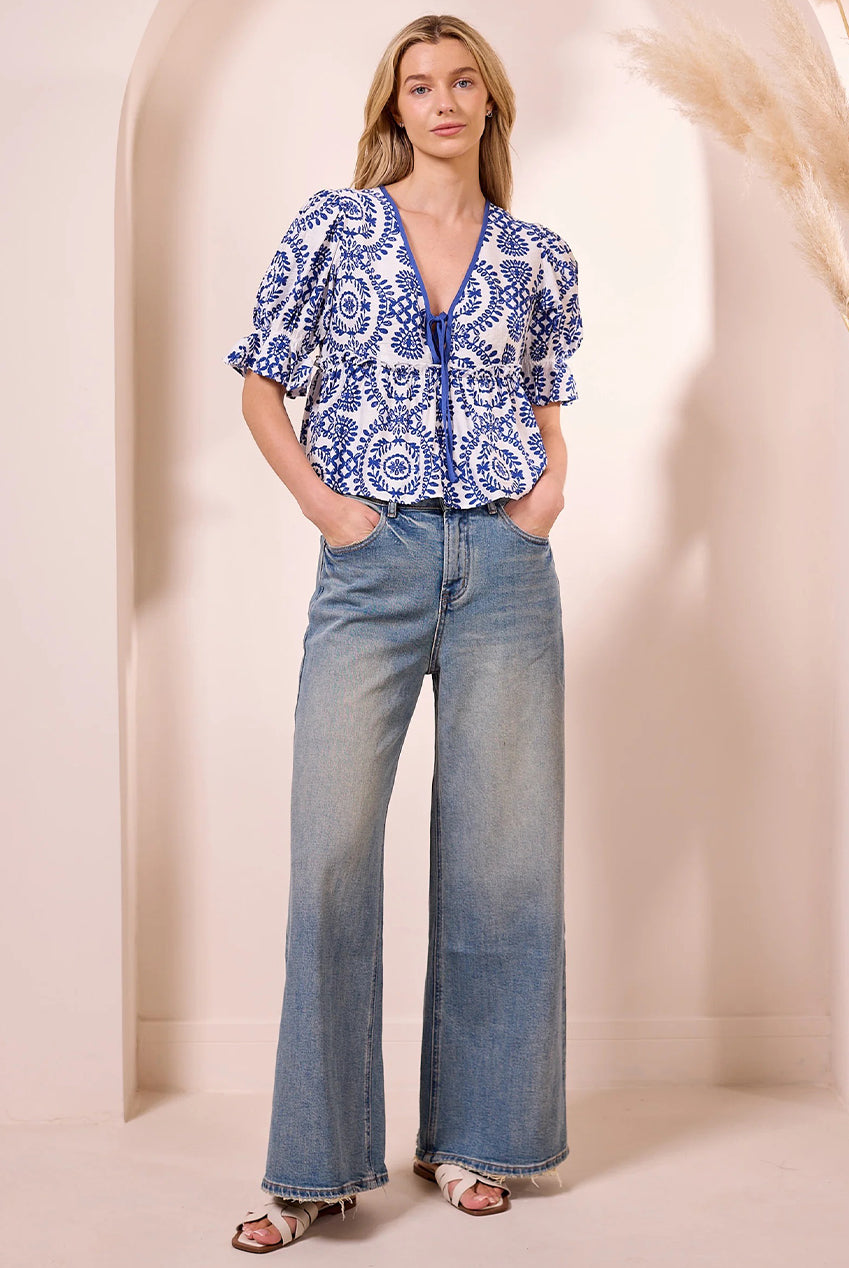 White Peplum Top With Blue Embroidery Print M043677