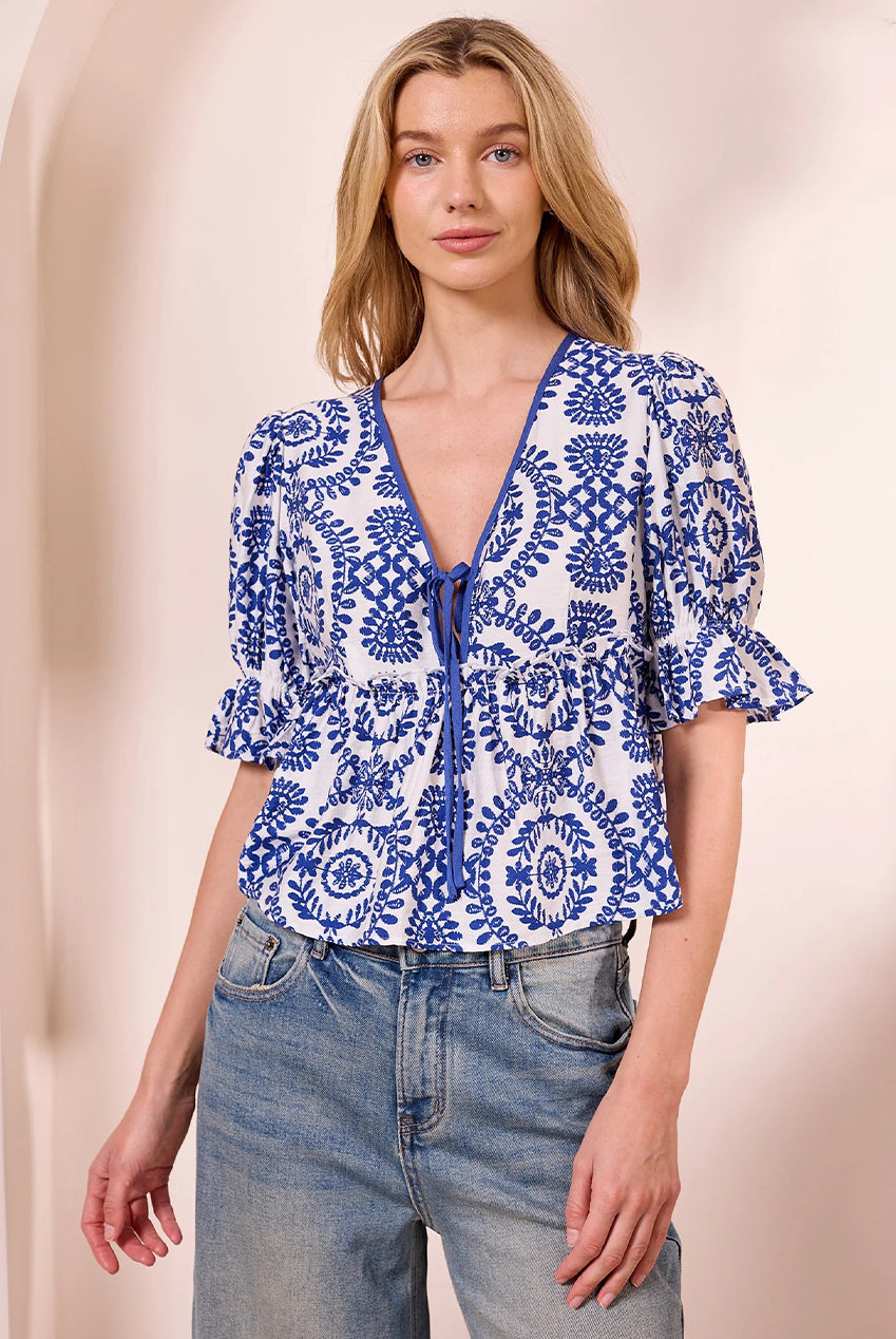 White Peplum Top With Blue Embroidery Print M043677