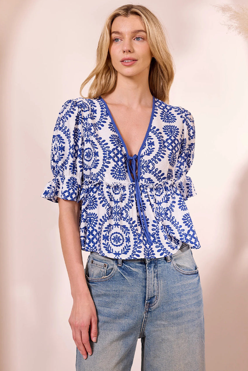 White Peplum Top With Blue Embroidery Print M043677
