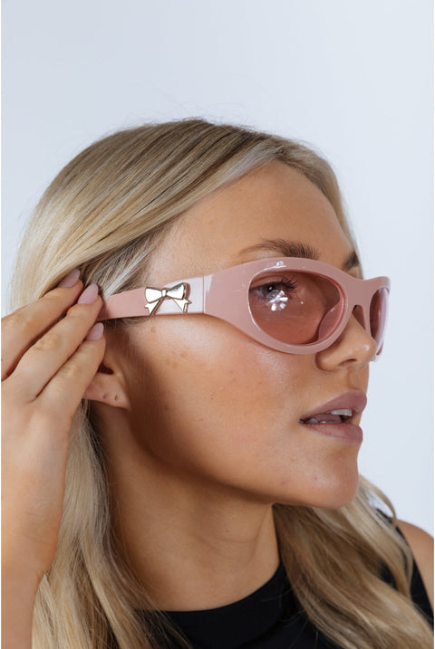 Wrap Around Racer Bow Sunglasses In Pink by SVNX