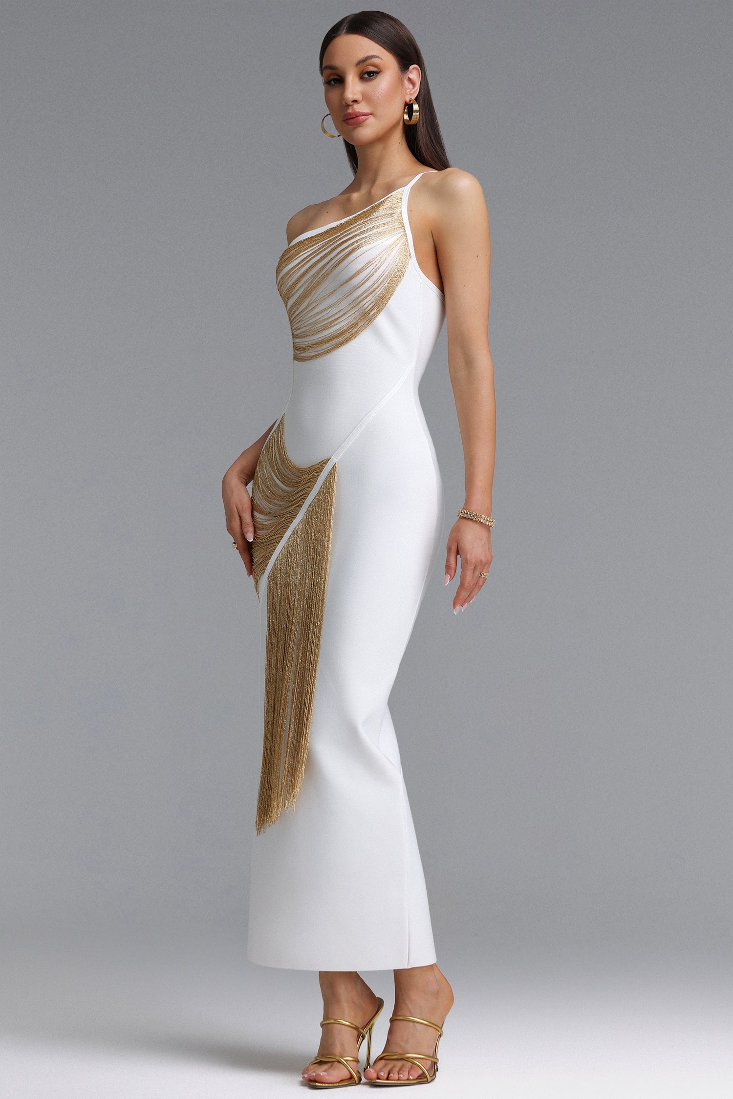Roanna One Shoulder Sleeveless Golden Tassels Bandage White Maxi Dress D250701239