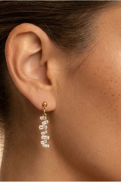 Gold - Vertical Dangle Earrings With Baguette Stones by MUCHV