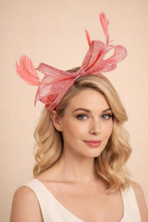 Bow Shaped Fascinator With Sinamay Curls & Feathers In Pink by SVNX