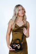 Metallic Bow Top Handle Bag In Black by SVNX