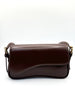 Curved Baguette Bag In Dark Brown by SVNX