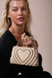 Heart Pearl Clutch Bag In Gold by SVNX
