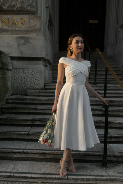 Ivory Pleated Flared Midi Skirt by InFlair