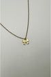 Mini Bow Pendant Necklace In Gold by SVNX