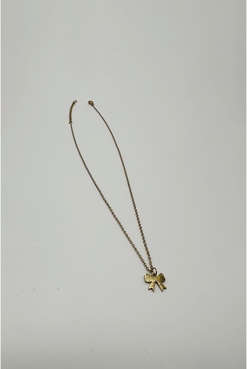Mini Bow Pendant Necklace In Gold JE412424
