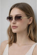 Jaguar Detail Rimless Sunglasses In Brown by SVNX